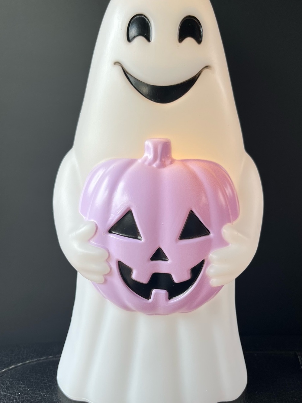 White Ghost Figurine Holding Pink Jack-O'-Lantern 10” by 5”